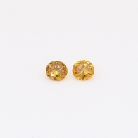 0.12 Total carat pair of round-cut fancy orange diamonds