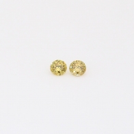 0.06 Total carat pair of round-cut yellow diamonds