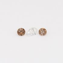 0.14 Total carat trio of round-cut champagne and white diamonds