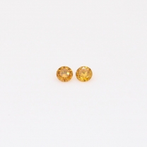 0.04 Total carat pair of round-cut fancy orange diamonds