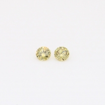 0.10 Total carat pair of round-cut fancy yellow diamonds