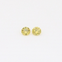 0.10 Total carat pair of round-cut fancy green diamonds